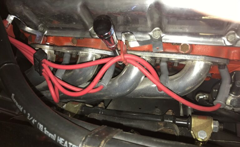 A Chevyy big block engine upgraded with headers and larger ignition wires