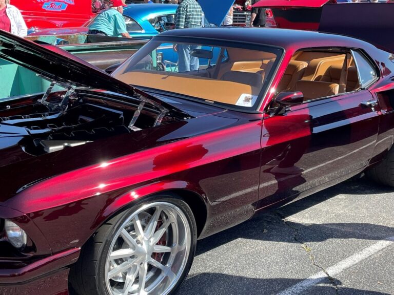 A red Ford Mustang customized into a resto-mod