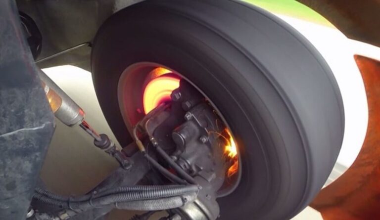 A rotating wheel showing the heat generated on the brake disc under heavy braking showing the need for maintaining car brakes
