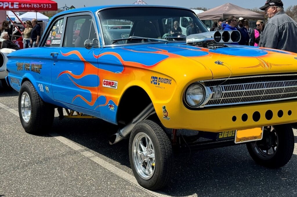 A blue straight axel Ford Falcon drag car with yellow flames with small block Ford engine with matching transmission