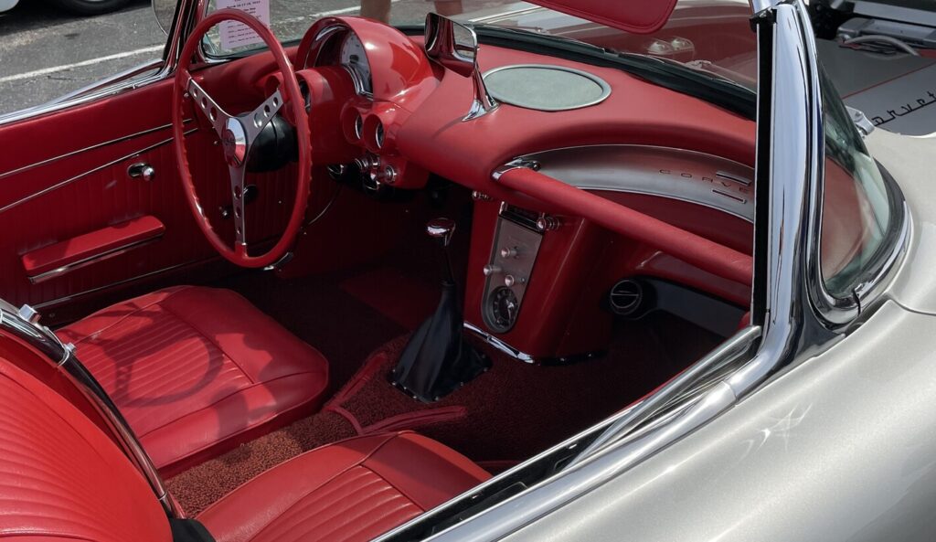 A silver with red interior C1 Corvette with aftermarket air conditioning installed