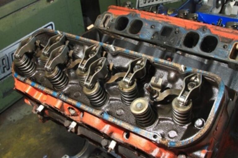 A Chevrolet big block engine with the valve covers and intake manifold removed to do prevent repairs to avoid major car engine problems