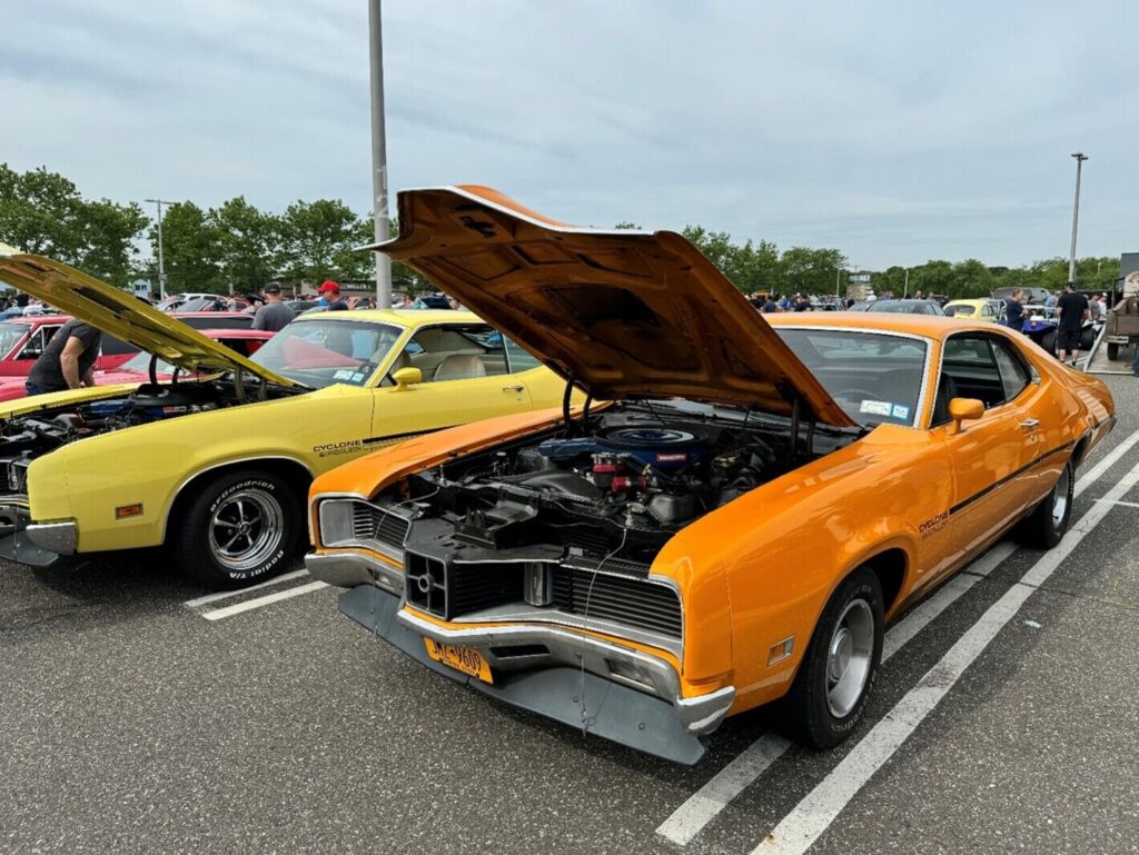 An orange and yellow Mercury Cyclones with freshly built engines ready for the car engine rev
