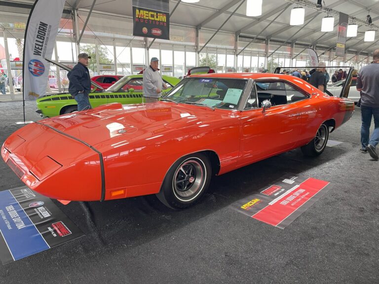 An orange 1969 Dodge Daytona at a classic car auction