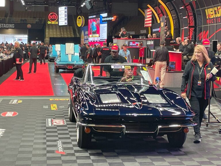 A group of 3 blue Corvettes crossing the auction block with buyers looking finance the purchase of a vintage car