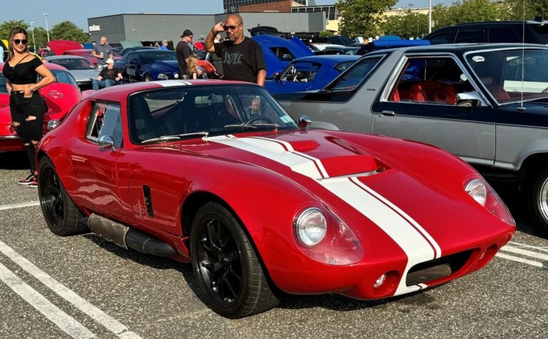 A red with white stripes kit car as a reproduction of a 60s classic is the future collectable