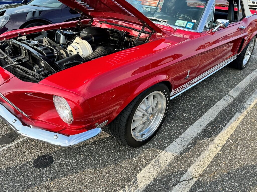 A red Mustang GT 350 with a remanufactured engine with a supercharger