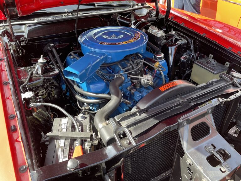 A blue Cobra 429 remanufactured engine installed in a Ford car