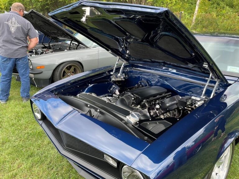 A blue custom 67 Chevy Camaro with a modern Chevrolet LS engine