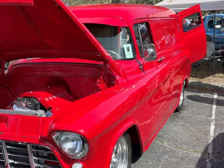 A red 50s Chevy panel truck with a modern LS engine