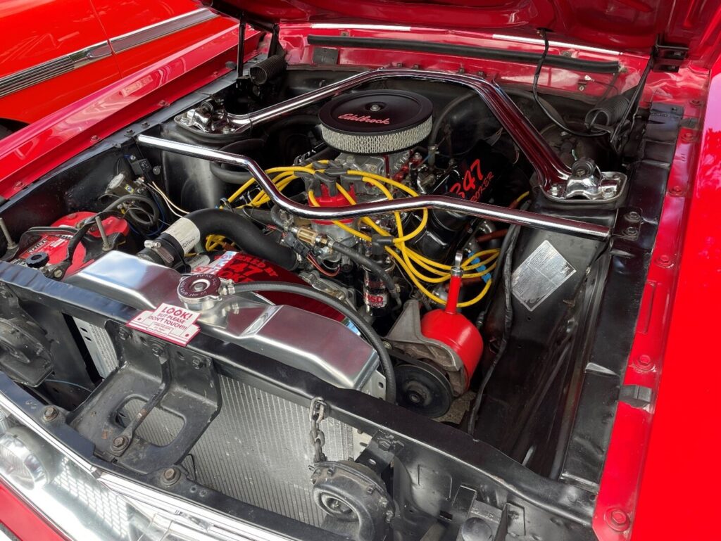 A stoker engine a red Ford car