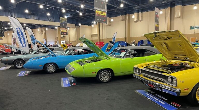 Plymouth classic cars on display including Superbirds at a car auction as bidders look to classic car investing